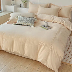 YOUMIKA  -  A Four Piece Set of Solid Color Quilts, Bed Sheets, and Seasonal Household Bedding on A Minimalist Wind Sanding Bed